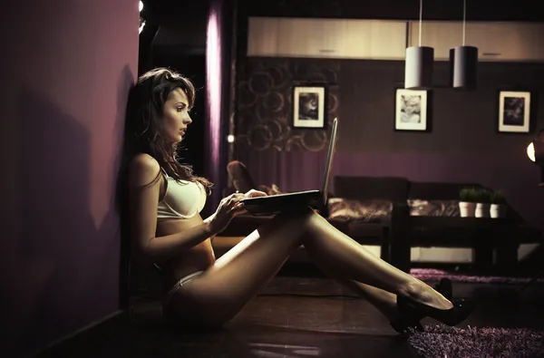 Sexy lady browsing internet late night
