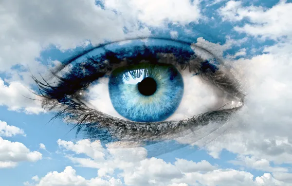Blue eye and blue sky - Spiritual concept
