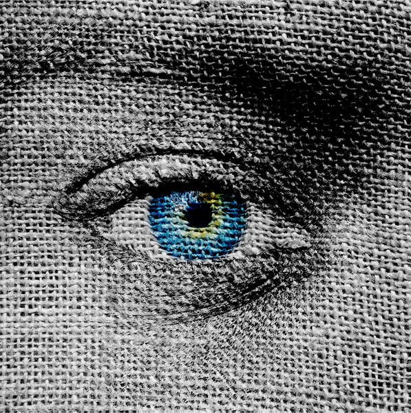 Blue eye on canvas background