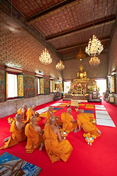 Buddhist monks sitting in temple