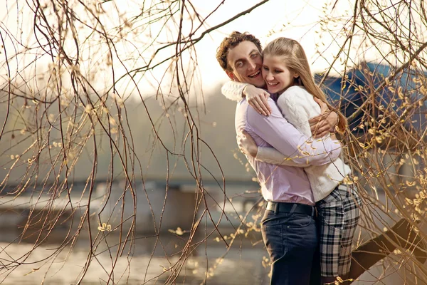Young couple having fun outdoors in early spring