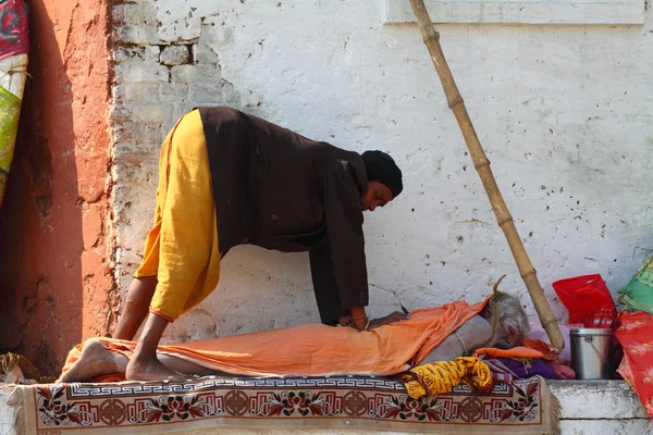 Indian men doing yoga in Varanasi, Uttar Pradesh, India.