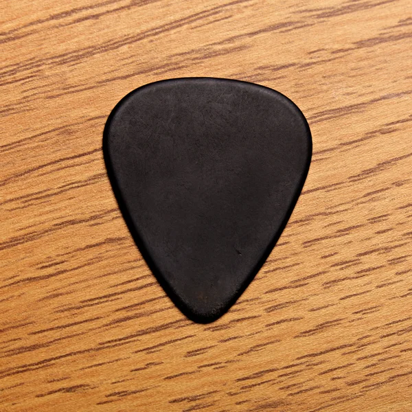 Guitar Pick Up on Wood