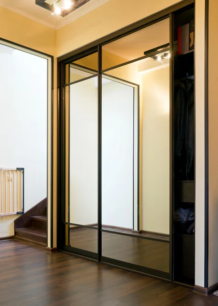 Mirror case in home vestibule