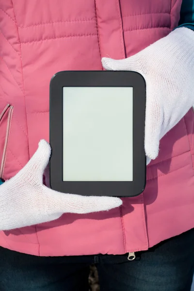 Woman's hands holding e-book reader