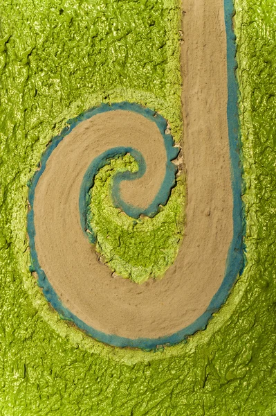 Spiral cement wall isolated on green art background