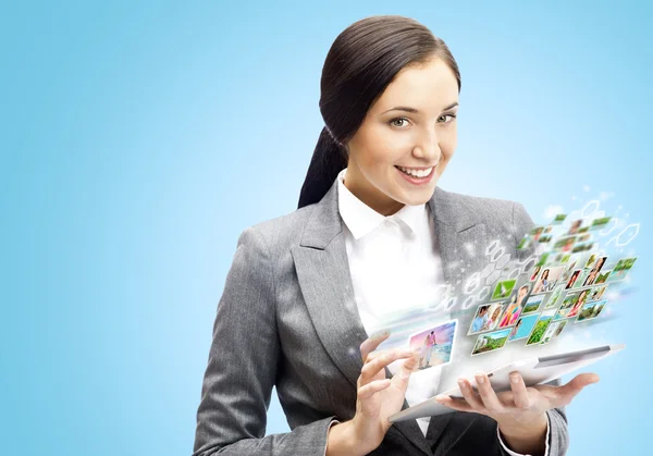 Business woman holding tablet computer. Working on touching scre