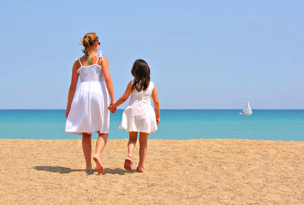 Two girls holding hands
