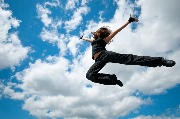 Beauty female dancer flying in the sky