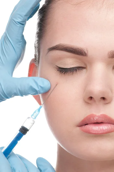Injection of botox to the face of beautiful woman