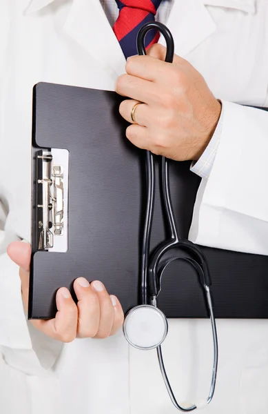 Close up of medical doctor with stethoscop and notebook.