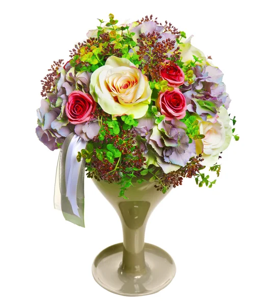 Arrangement of flowers and ribbons in a glass vase