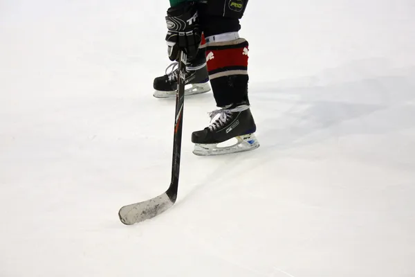 Simple amateur hockey skates and stick