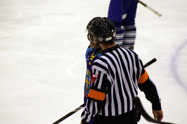 Scene with hockey referee on ice