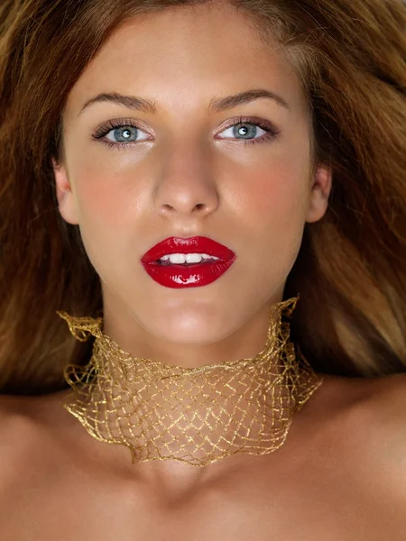 Closeup beauty portrait woman with golden jewels