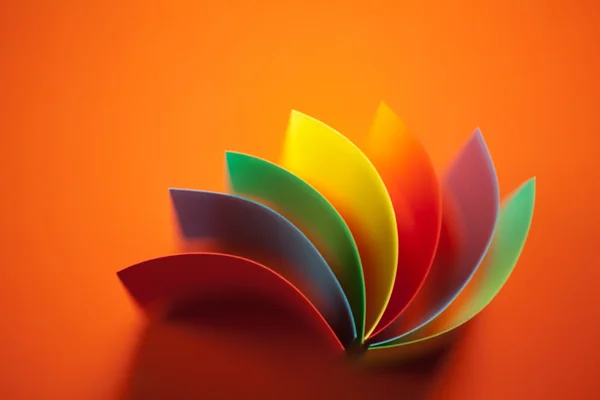 abstract colored paper structure on orange background