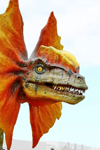 Dilophosaurus dinosaur with orange collar
