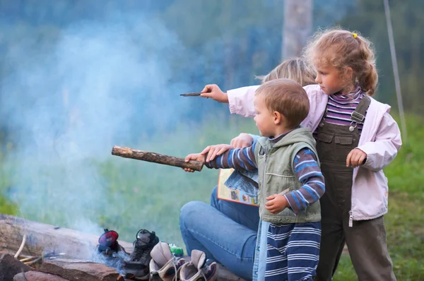 Family near campfire