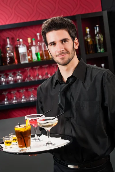 Professional barman cocktail bar hold serving tray