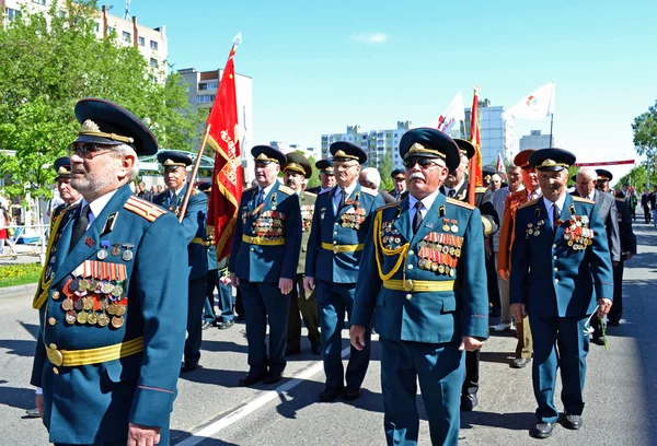 Victory Day. Festive demonstration.Veterans in a system.