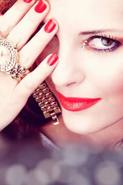Beautiful woman with pink lips and watch