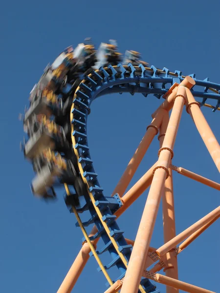 Moving roller coaster with blue sky