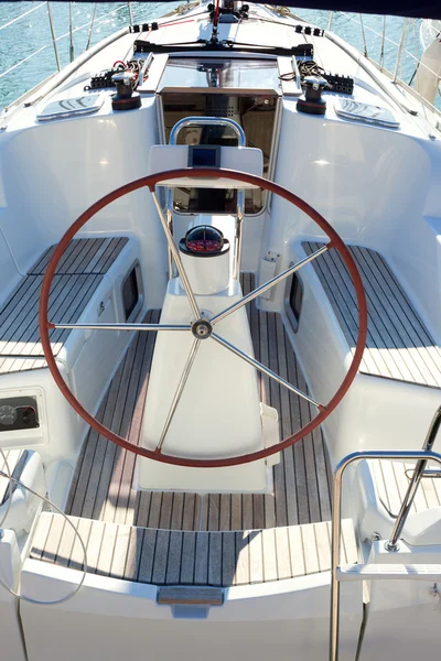 Boat stern with big steering wheel sailboat