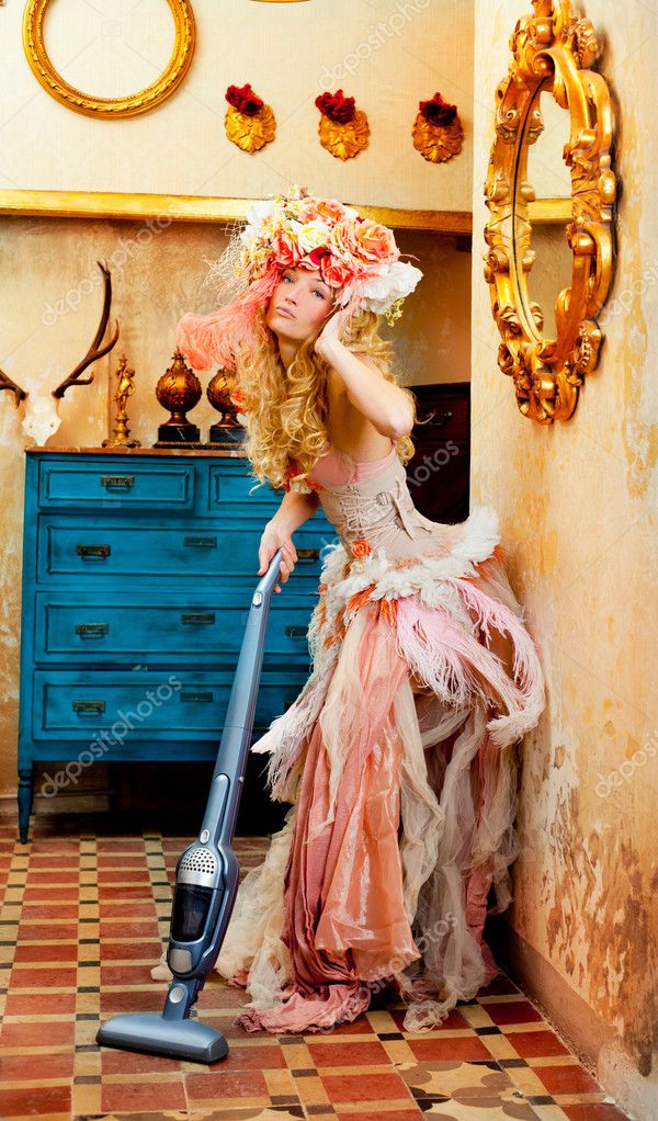 Baroque fashion blonde housewife woman at vacuum cleaner chores