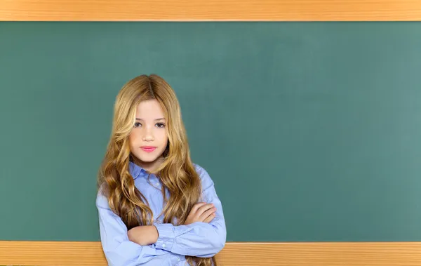 Kid student girl on green school blackboard