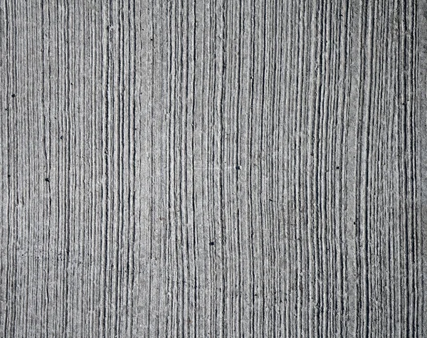 Gray concrete wall texture with relief lines