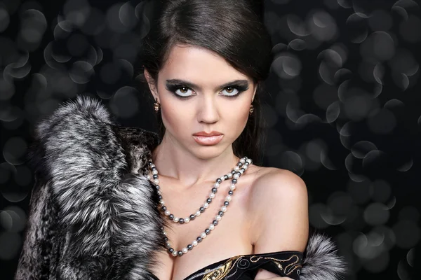 Photo of sexual beautiful girl is in fashion style, fur coat