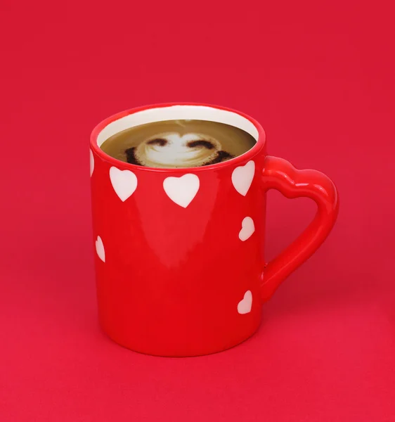 Cup of coffee isolated on red
