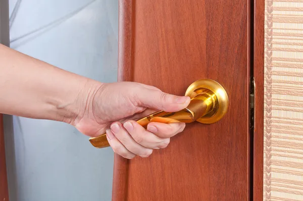 Hand and the door handle