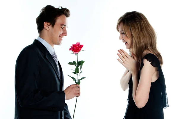 Man gives a woman flowers