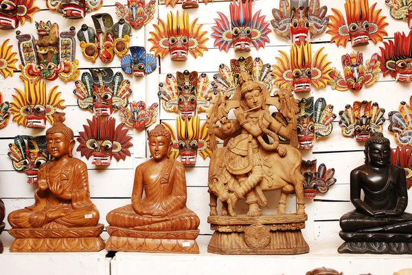 Traditional masks and buddha statue of the devil at the shop