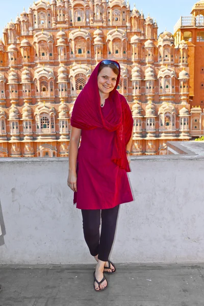 Beautiful european woman in front of Hawa Mahal in Jaipur, Rajas