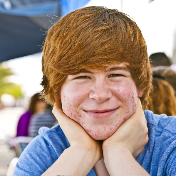 Outdoor portrait of relaxed cute young boy