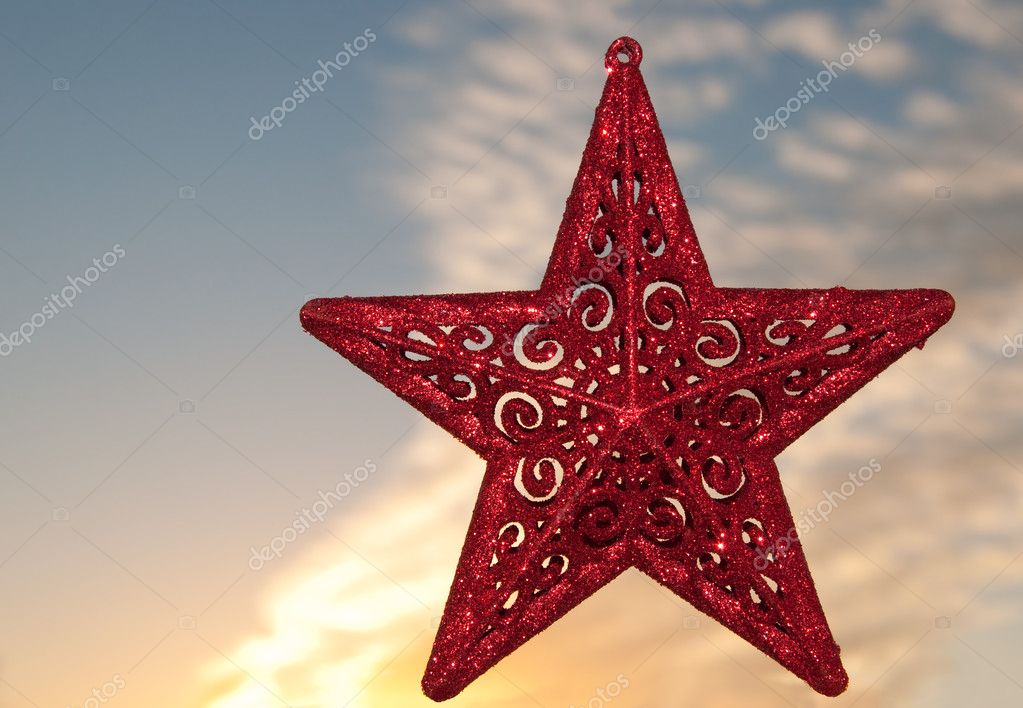 Beautiful red Christmas star ornament against sunset sky — Stock Photo