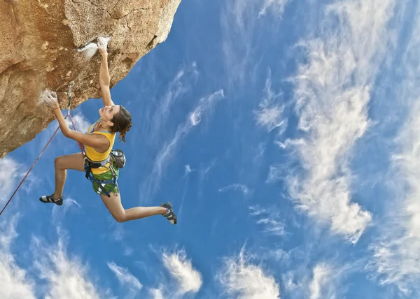 Rock climber dangling.