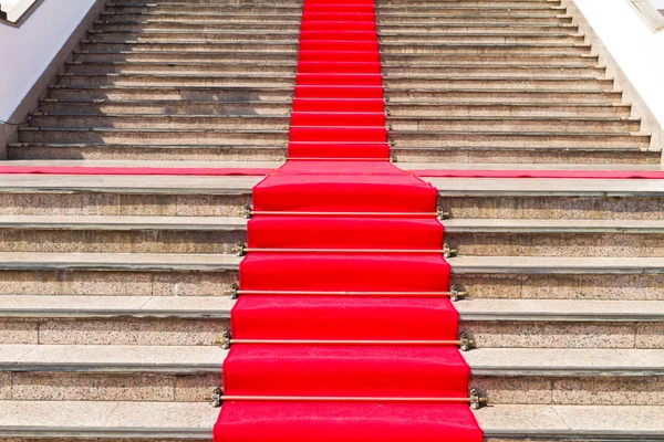 Red carpet way on staircase