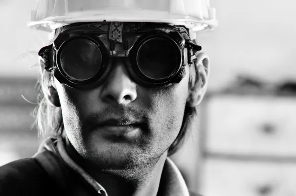 Black and white photo of a man in helmet and goggles