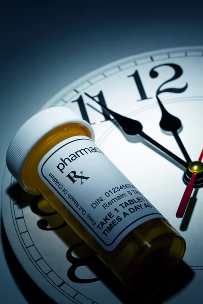 Clock and Pill Bottle