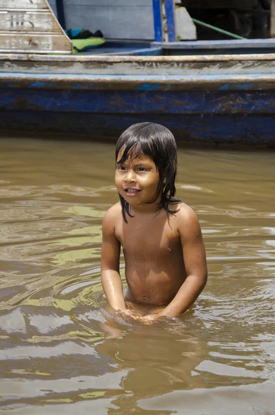 A girl in the Amazon River
