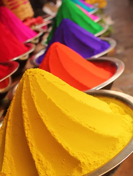 Colorful piles of powdered dyes on display