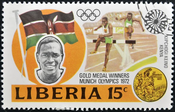 LIBERIA - CIRCA 1973: stamp printed in Liberia shows Gold medal winners in 20th Olympic Games, Kipchoge Keino, Kenya, 3000-meter steeplechase, circa 1973