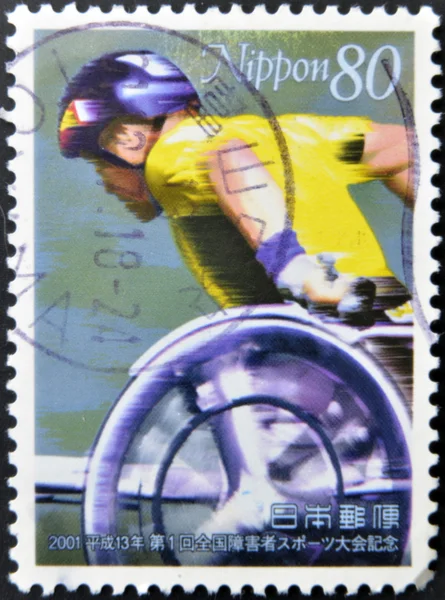 JAPAN - CIRCA 2001: A stamp printed in Japan dedicated to National Sports Festival for with Disabilities, shows wheelchair race, circa 2001