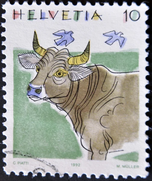 A stamp printed in Switzerland, shows a cow