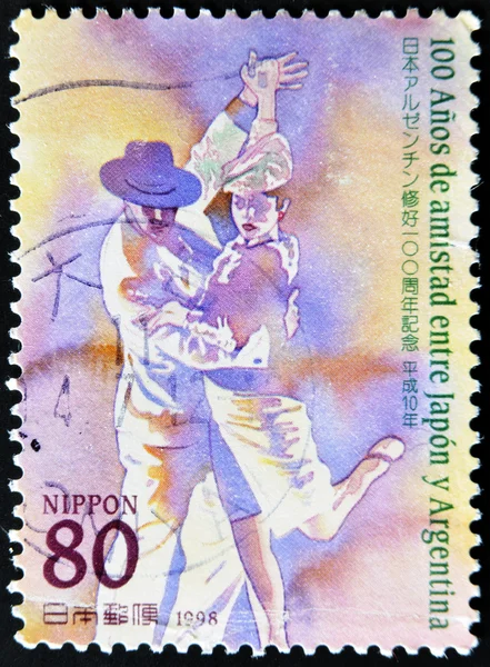 JAPAN - CIRCA 1998: A stamp printed in Japan commemorating 100 years of friendship between Argentina and Japan, shows a couple dancing tango, circa 1998