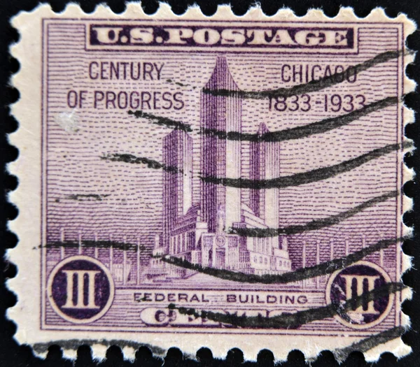 UNITED STATES OF AMERICA - CIRCA 1933: A stamp printed in USA shows Federal building at Chicago, 100th anniversary of the incorporation Chicago as a city, circa 1933