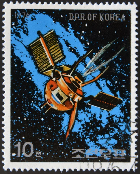 NORTH KOREA - CIRCA 1976: A stamp printed in North Korea shows a space station against a sea of stars and the Milky Way galaxy, circa 1976.